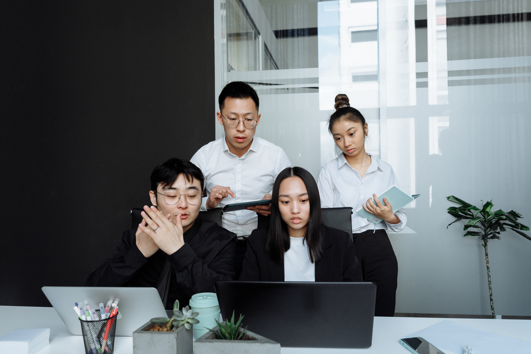 A Group of People Having a Meeting in the Office